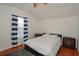 Spacious bedroom with hardwood floors and a ceiling fan at 1933 Island Walk Dr, Orlando, FL 32824