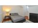 Cozy bedroom with a double bed, dresser, and hardwood floors at 1933 Island Walk Dr, Orlando, FL 32824