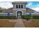Gated entrance to community pool with landscaping and walkway at 1933 Island Walk Dr, Orlando, FL 32824