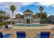 Inviting community pool with lounge chairs and surrounding patio at 1933 Island Walk Dr, Orlando, FL 32824
