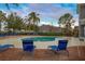 Relaxing kidney-shaped community pool with plenty of lounge chairs at 1933 Island Walk Dr, Orlando, FL 32824