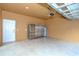 Attached garage with storage cabinets and refrigerator at 1933 Island Walk Dr, Orlando, FL 32824