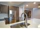 Modern kitchen with a stainless steel sink and faucet at 1933 Island Walk Dr, Orlando, FL 32824
