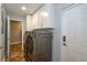 Laundry room with modern washer and dryer and white cabinets at 1933 Island Walk Dr, Orlando, FL 32824