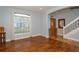 Spacious living area with hardwood floors and large windows at 1933 Island Walk Dr, Orlando, FL 32824