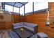 Cozy patio with wicker furniture and wood walls at 1933 Island Walk Dr, Orlando, FL 32824