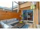 Outdoor patio with seating area and view to dining room at 1933 Island Walk Dr, Orlando, FL 32824