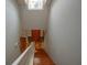 Elegant wooden staircase with white railing leading to the second floor at 1933 Island Walk Dr, Orlando, FL 32824