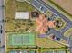 Aerial view of community with tennis court and playground at 220 Brunello Dr, Davenport, FL 33897