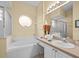 Bathroom with a large garden tub, double vanity, and separate shower at 220 Brunello Dr, Davenport, FL 33897