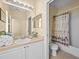 Bathroom with tub, toilet and vanity at 220 Brunello Dr, Davenport, FL 33897