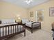 Bedroom with two twin-size beds and nightstands at 220 Brunello Dr, Davenport, FL 33897