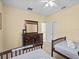 Bedroom with two twin beds and dresser at 220 Brunello Dr, Davenport, FL 33897