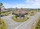 Community clubhouse with fountain and parking at 220 Brunello Dr, Davenport, FL 33897