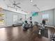 Well-equipped fitness center featuring treadmills, ellipticals, and weight machines at 220 Brunello Dr, Davenport, FL 33897