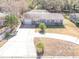 Property features a large yard, driveway, and detached garage at 2219 Pilaklakaha Ave, Auburndale, FL 33823