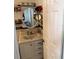 Small bathroom with vanity and oval mirror at 2219 Pilaklakaha Ave, Auburndale, FL 33823