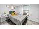 Cozy bedroom with neutral walls and patterned bedding at 2219 Pilaklakaha Ave, Auburndale, FL 33823