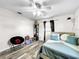Bedroom with double bed and ceiling fan at 2219 Pilaklakaha Ave, Auburndale, FL 33823