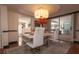 Elegant dining room with a modern white table and chairs at 2219 Pilaklakaha Ave, Auburndale, FL 33823