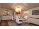 Bright dining room with hardwood floors and a modern light fixture at 2219 Pilaklakaha Ave, Auburndale, FL 33823