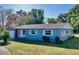 Ranch-style home with a freshly painted exterior and a well-manicured lawn at 2219 Pilaklakaha Ave, Auburndale, FL 33823