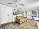 Cozy Gathering room featuring a comfortable sofa and built-in shelving at 2219 Pilaklakaha Ave, Auburndale, FL 33823