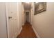 Bright hallway with wood-look flooring, leading to other rooms at 2219 Pilaklakaha Ave, Auburndale, FL 33823