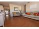 Spacious living area with hardwood flooring, leading to the dining and kitchen area at 2219 Pilaklakaha Ave, Auburndale, FL 33823