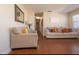 Bright and airy living room with hardwood floors and neutral decor at 2219 Pilaklakaha Ave, Auburndale, FL 33823