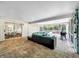 Spacious covered patio with seating area overlooking the refreshing pool at 2219 Pilaklakaha Ave, Auburndale, FL 33823