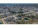 Wide view of suburban neighborhood and lake at 223 Elm Ct, Kissimmee, FL 34759