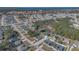 Neighborhood overview with home highlighted near a lake at 223 Elm Ct, Kissimmee, FL 34759