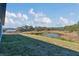 Spacious backyard with pond and conservation views at 223 Elm Ct, Kissimmee, FL 34759