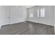 Bright entryway with gray vinyl plank flooring and white door at 223 Elm Ct, Kissimmee, FL 34759