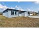 Gray house exterior with black shutters and landscaping at 223 Elm Ct, Kissimmee, FL 34759