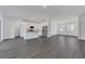 Modern kitchen with white cabinets, granite countertops, and stainless steel appliances at 223 Elm Ct, Kissimmee, FL 34759