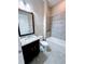Bathroom with granite vanity, tiled shower/tub combo, and mirror at 2438 Yellow Brick Rd, St Cloud, FL 34772