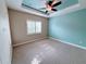 Spacious bedroom with neutral walls, carpeting, and ceiling fan at 2438 Yellow Brick Rd, St Cloud, FL 34772