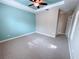 Bright bedroom featuring neutral walls and plush carpeting at 2438 Yellow Brick Rd, St Cloud, FL 34772