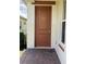 Solid wood door with brass hardware at 2438 Yellow Brick Rd, St Cloud, FL 34772