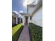 Inviting front entry with red door and brick walkway at 2438 Yellow Brick Rd, St Cloud, FL 34772