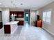 Kitchen with granite island, stainless steel appliances, and dark wood cabinets at 2438 Yellow Brick Rd, St Cloud, FL 34772