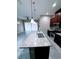 Granite countertop kitchen island with double sink and stainless steel appliances at 2438 Yellow Brick Rd, St Cloud, FL 34772