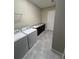 Laundry room with washer, dryer, and a utility sink at 2438 Yellow Brick Rd, St Cloud, FL 34772