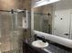 Modern bathroom with a large walk-in shower and granite vanity at 3034 Boating Blvd, Kissimmee, FL 34746