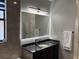 Bathroom features a large vanity with a modern mirror at 3034 Boating Blvd, Kissimmee, FL 34746