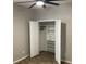 White double-door closet with shelves and drawers at 3034 Boating Blvd, Kissimmee, FL 34746