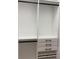 Walk-in closet with custom shelving, drawers, and hanging rods for ample storage space at 3034 Boating Blvd, Kissimmee, FL 34746