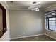 Bright dining room with large window and modern light fixture at 3034 Boating Blvd, Kissimmee, FL 34746